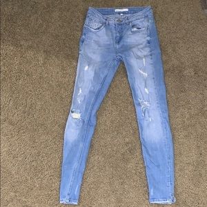 Light blue ripped skinny jeans